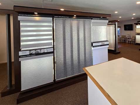 Store interior showcasing several different types of window coverings